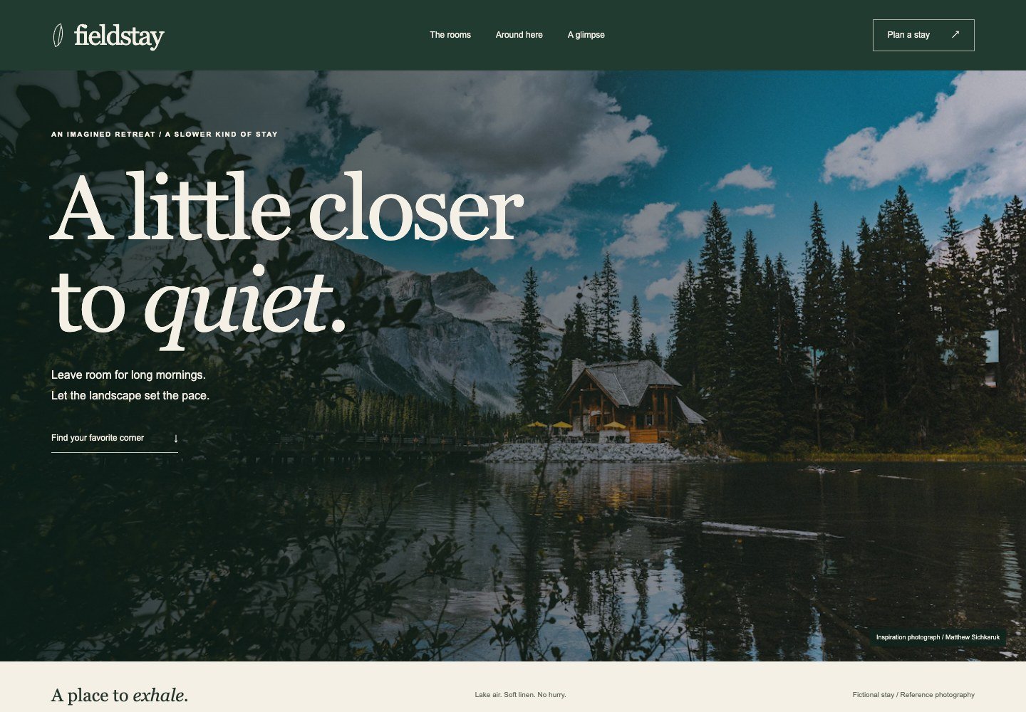 Lakeside cabin photograph filling the hero, with white serif text and a dark-green navigation bar.